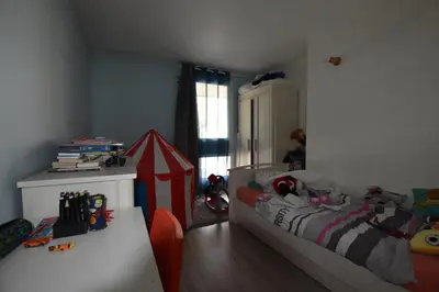 Un ou plusieurs lits dans un hébergement de l'établissement Vaste Appartement dupleix 3 chambre proche Stade de France