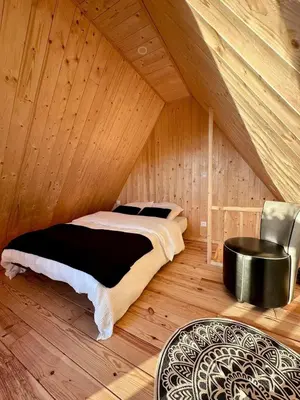 Un ou plusieurs lits dans un hébergement de l'établissement Tiny house