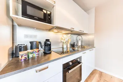 Cuisine ou kitchenette dans l'établissement Appartement 6prs - Hyper Centre - Idéal famille et pro