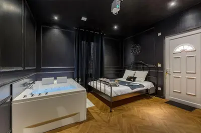 Un ou plusieurs lits dans un hébergement de l'établissement Le Spa Nocturne