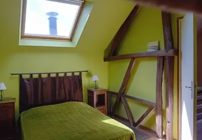 Un ou plusieurs lits dans un hébergement de l'établissement Gîte la chouette hulotte