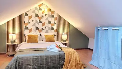 Un ou plusieurs lits dans un hébergement de l'établissement Le Duplex du Moulin - Maison T2 cosy centre-ville