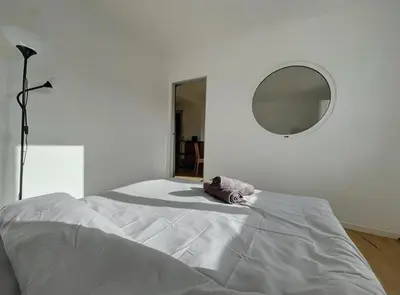 Un ou plusieurs lits dans un hébergement de l'établissement Appartement