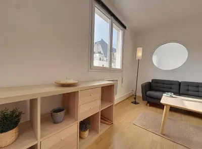 Coin salon dans l'établissement Appartement