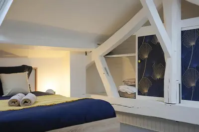 Un ou plusieurs lits dans un hébergement de l'établissement Le Duplex Cosy