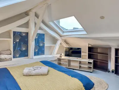 Un ou plusieurs lits dans un hébergement de l'établissement Le Duplex Cosy