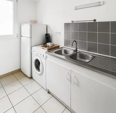 Cuisine ou kitchenette dans l'établissement T2 moderne terrasse, parking, proche commerces