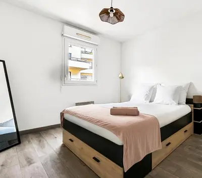 Un ou plusieurs lits dans un hébergement de l'établissement T2 moderne terrasse, parking, proche commerces