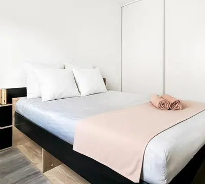 Un ou plusieurs lits dans un hébergement de l'établissement T2 moderne terrasse, parking, proche commerces