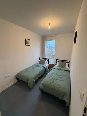 Un ou plusieurs lits dans un hébergement de l'établissement APPARTEMENT F3 BUCHELAY Calme parking privé proche de la gare