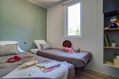 Un ou plusieurs lits dans un hébergement de l'établissement Cottage Friends 10p AirCon