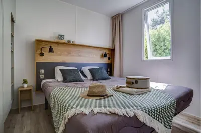 Un ou plusieurs lits dans un hébergement de l'établissement Cottage Friends 10p AirCon