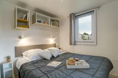 Un ou plusieurs lits dans un hébergement de l'établissement Cottage 6p