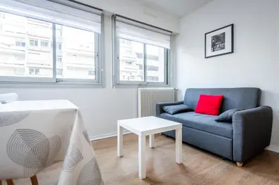 Coin salon dans l'établissement Appartement City Hall et Parking privé