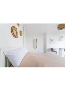 Un ou plusieurs lits dans un hébergement de l'établissement Studio lumineux, cosy et bien équipé