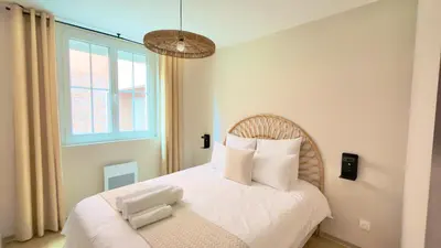 Un ou plusieurs lits dans un hébergement de l'établissement Abyssea - Appartement Chic Centre-Ville & Netflix
