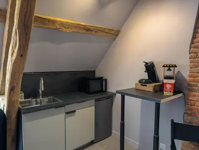 Cuisine ou kitchenette dans l'établissement Cinéma Room romantique Studio de l'Etoile