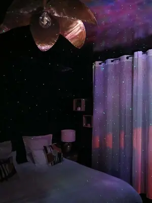 Un ou plusieurs lits dans un hébergement de l'établissement la penombre spa
