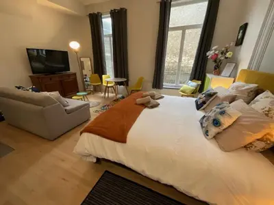Un ou plusieurs lits dans un hébergement de l'établissement Cosy Bora Bora-Confort pour 4 personnes à Amiens
