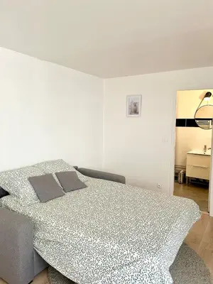 Un ou plusieurs lits dans un hébergement de l'établissement Studio Cosy Centre ville