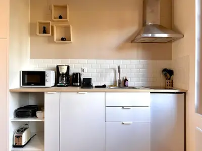 Cuisine ou kitchenette dans l'établissement Le Clocher - 1 Chambre - Wifi