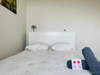 Un ou plusieurs lits dans un hébergement de l'établissement Évasion avec vue panoramique sur Rouen - 424
