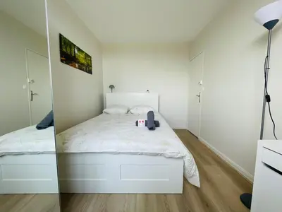 Un ou plusieurs lits dans un hébergement de l'établissement Évasion avec vue panoramique sur Rouen - 424