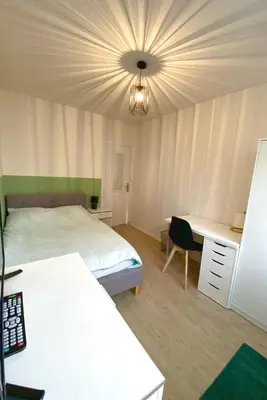 Un ou plusieurs lits dans un hébergement de l'établissement Coloc studio standing mueble netflix gare