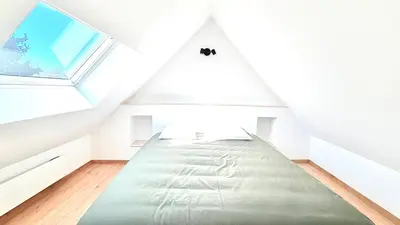 Un ou plusieurs lits dans un hébergement de l'établissement Maison cosy dans village de charme avec commerces