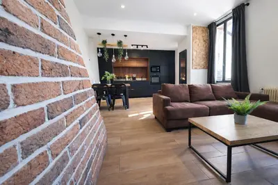 Coin salon dans l'établissement Les Palmiers moderne à 10 min de Rouen