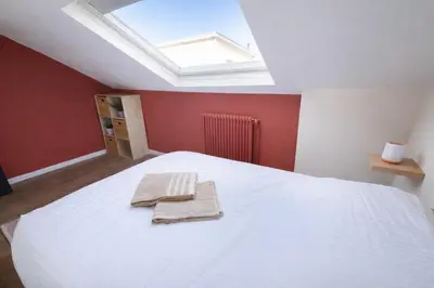 Un ou plusieurs lits dans un hébergement de l'établissement Les Palmiers moderne à 10 min de Rouen