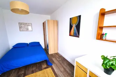 Un ou plusieurs lits dans un hébergement de l'établissement Escapade Rouennaise Séjour Confortable Rouen