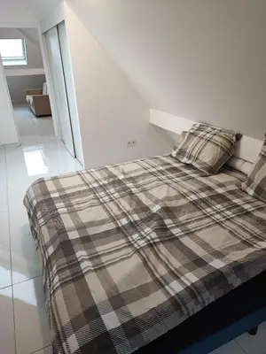 Un ou plusieurs lits dans un hébergement de l'établissement Apartment G
