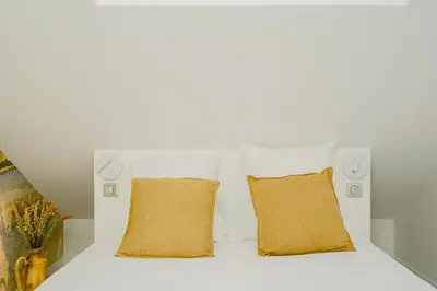 Un ou plusieurs lits dans un hébergement de l'établissement Maison Soleil Levant