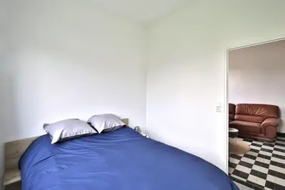 Un ou plusieurs lits dans un hébergement de l'établissement Le Cosy Chic - Avec jardin et parking