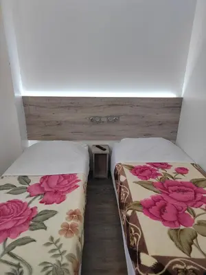 Un ou plusieurs lits dans un hébergement de l'établissement Alpha Hotel