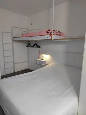 Un ou plusieurs lits dans un hébergement de l'établissement Alpha Hotel