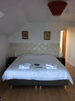 Un ou plusieurs lits dans un hébergement de l'établissement Auberge du Vieux Puits