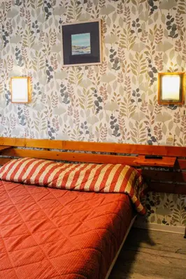 Un ou plusieurs lits dans un hébergement de l'établissement chambres d'hotes du colvert