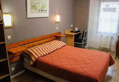 Un ou plusieurs lits dans un hébergement de l'établissement chambres d'hotes du colvert