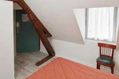 Un ou plusieurs lits dans un hébergement de l'établissement chambres d'hotes du colvert