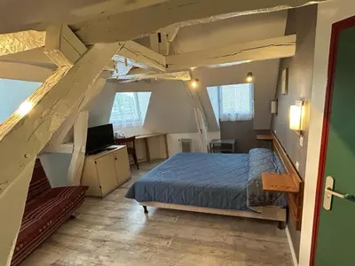 Un ou plusieurs lits dans un hébergement de l'établissement chambres d'hotes du colvert