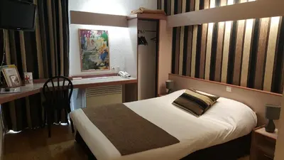 Un ou plusieurs lits dans un hébergement de l'établissement Hôtel Eclipse
