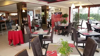 Restaurant ou autre lieu de restauration dans l'établissement Hôtel Eclipse