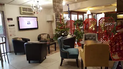 Coin salon dans l'établissement Hôtel Eclipse
