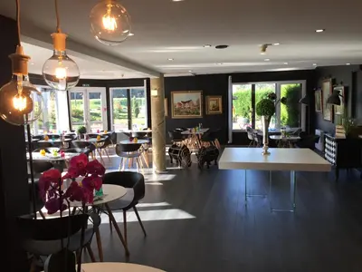 Coin salon dans l'établissement Hotel Restaurant Baryton