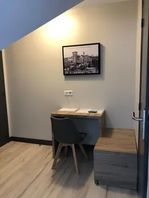 Télévision ou salle de divertissement dans l'établissement LOGIS - Hôtel & Restaurant Saint Nicolas