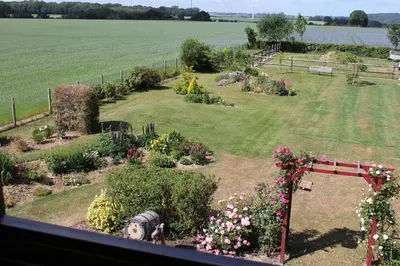 Jardin de l'établissement Chambre D'hotes Le Clos Fleuri