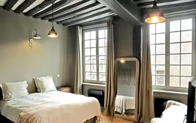 Un ou plusieurs lits dans un hébergement de l'établissement Hotel Du Grand Cerf & Spa