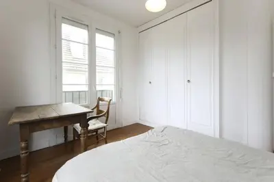 Un ou plusieurs lits dans un hébergement de l'établissement Chambres meublées chez l'habitant dans appartement proche gare sncf